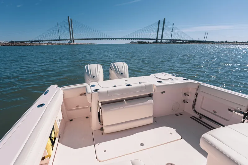 Slide: The Image of 2024 Grady-White Freedom 307 boat interior with scenic bridge view. - 22