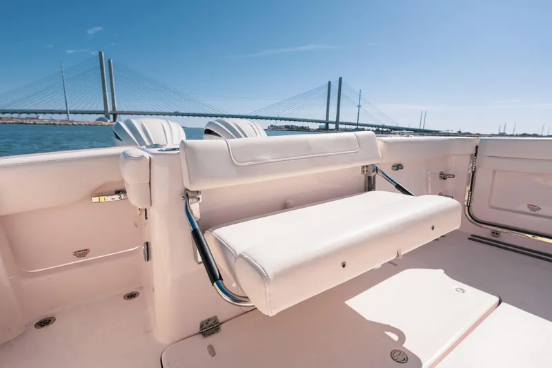 Slide: The Image of 2024 Grady-White Freedom 307 boat interior with bridge view in background. - 23