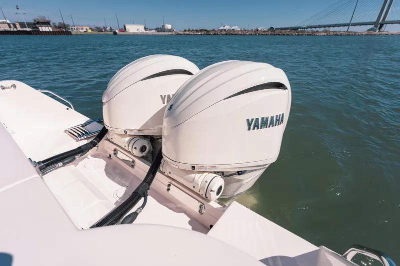 Slide: The Image of 2024 Grady-White Freedom 307 boat with dual Yamaha outboard engines on water. - 24