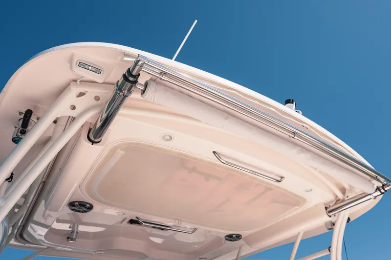 Slide: The Image of 2024 Grady-White Freedom 307 boat canopy against clear blue sky. - 25