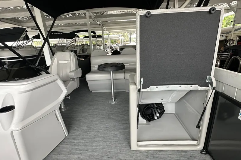 Slide: The Image of Interior of 2026 Sweetwater 2286FX boat with seating and storage area. - 10