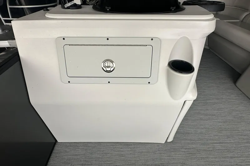 Slide: The Image of Sweetwater 2286FX 2026 boat console with storage compartment and cup holder. - 11