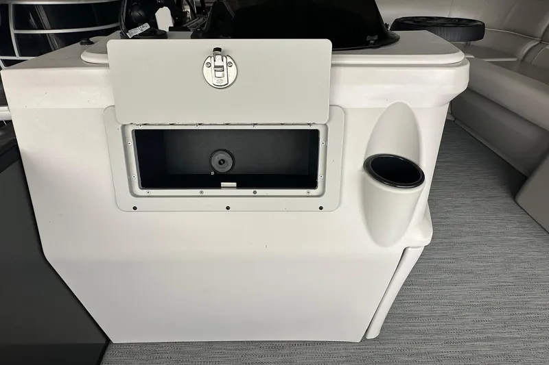 Slide: The Image of Sweetwater 2286FX 2026 boat console with storage compartment and cup holder. - 12