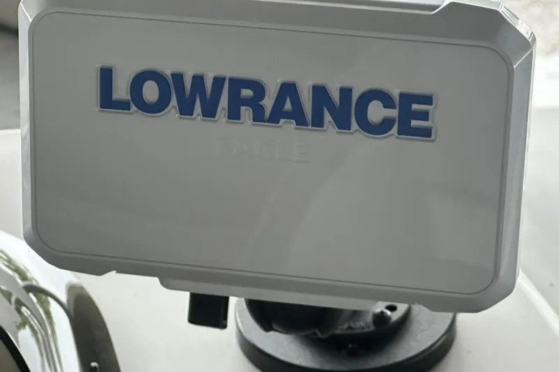 Slide: The Image of Lowrance device on Sweetwater 2286FX, 2026 model, mounted on a boat dashboard. - 15