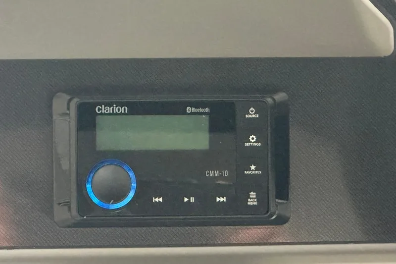 Slide: The Image of Clarion CMM-10 Bluetooth stereo system in 2026 Sweetwater 2286FX boat dashboard. - 17