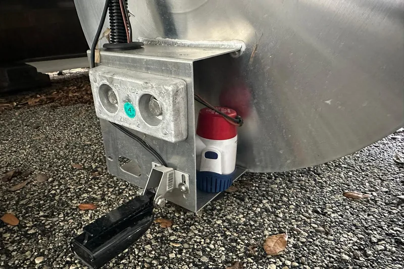 Slide: The Image of Close-up of Sweetwater 2286FX 2026 boat component on gravel surface. - 30