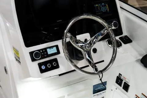 Slide: The Image of Manufacturer Provided Image: 2023 Edgewater 248CX Crossover boat dashboard with steering wheel and control panel. - 7