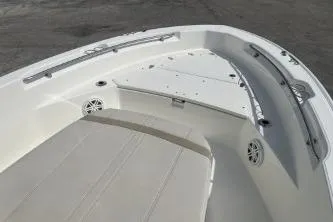 Slide: The Image of 2024 Boston Whaler 220 Dauntless boat interior with seating and storage compartments. - 10