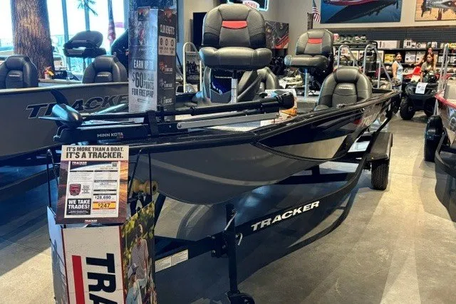 Slide: The Image of 2026 Tracker Pro Team 175 boat displayed in a showroom with promotional materials. - 51