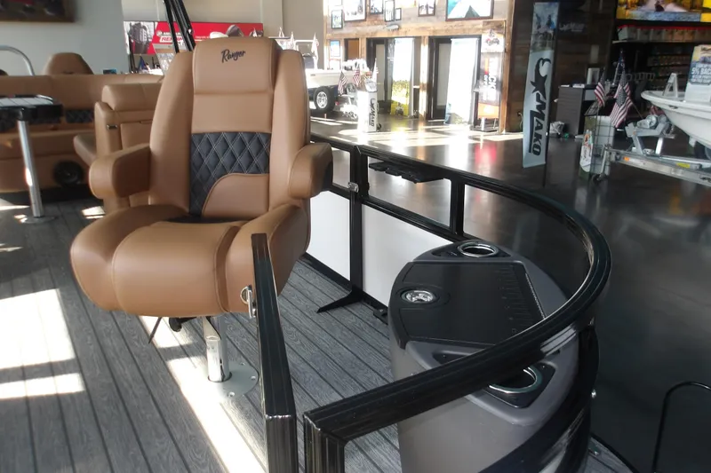 Slide: The Image of Luxurious seating on 2026 Ranger 220F boat, featuring tan leather and modern design. - 67