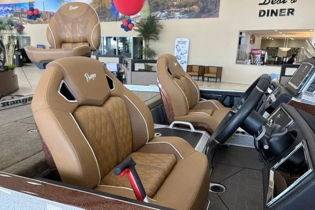Slide: The Image of 2026 Ranger Z520R Cup-Equipped boat interior with luxurious brown leather seats and modern dashboard. - 6