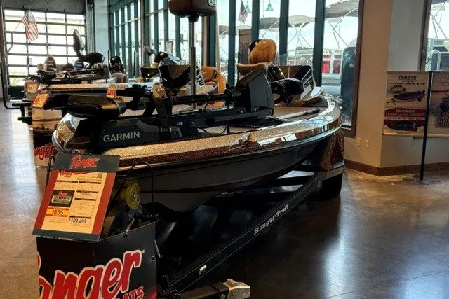 Slide: The Image of 2026 Ranger Z520R Cup-Equipped boat displayed in showroom with Garmin equipment. - 1