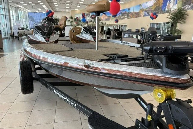 Slide: The Image of 2026 Ranger Z520R Cup-Equipped boat displayed in showroom with festive balloons. - 1