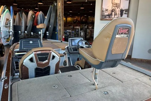 Slide: The Image of 2026 Ranger Z520R Cup-Equipped boat interior with seating and control panel in showroom. - 4