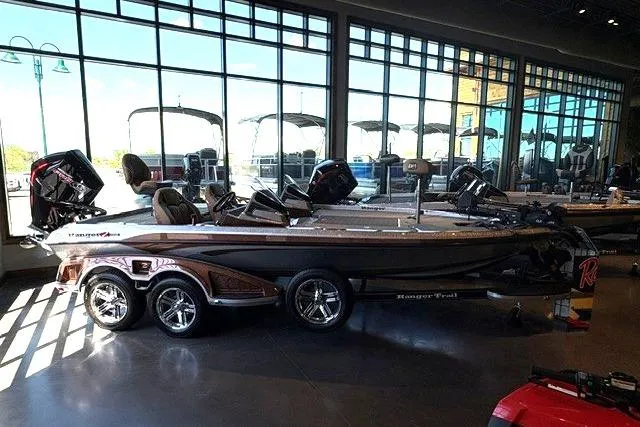 The Image of 2026 Ranger Z520R Cup-Equipped boat displayed indoors with large windows in the background. - 0