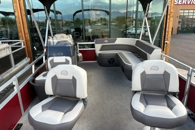 Slide: The Image of 2026 Sun Tracker Bass Buggy 16 XL Select pontoon boat with spacious seating and modern design. - 2
