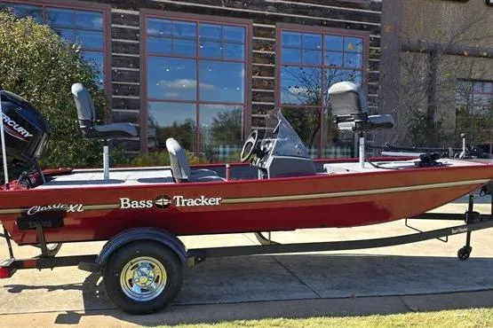 The Image of 2026 Tracker Bass Tracker Classic XL boat on trailer, parked outdoors. - 0