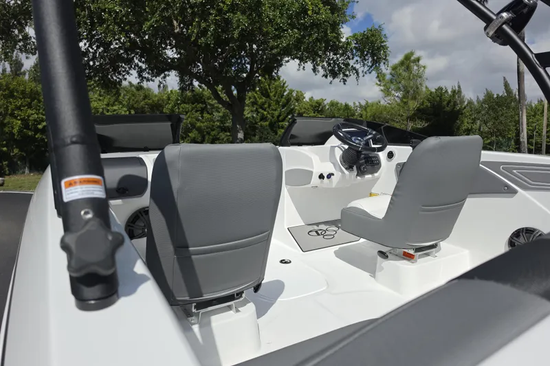 Slide: The Image of Interior of 2026 Tahoe T21 boat with gray seats and steering wheel. - 6