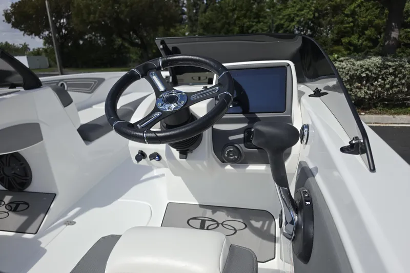 Slide: The Image of 2026 Tahoe T21 boat cockpit with steering wheel and control panel. - 7