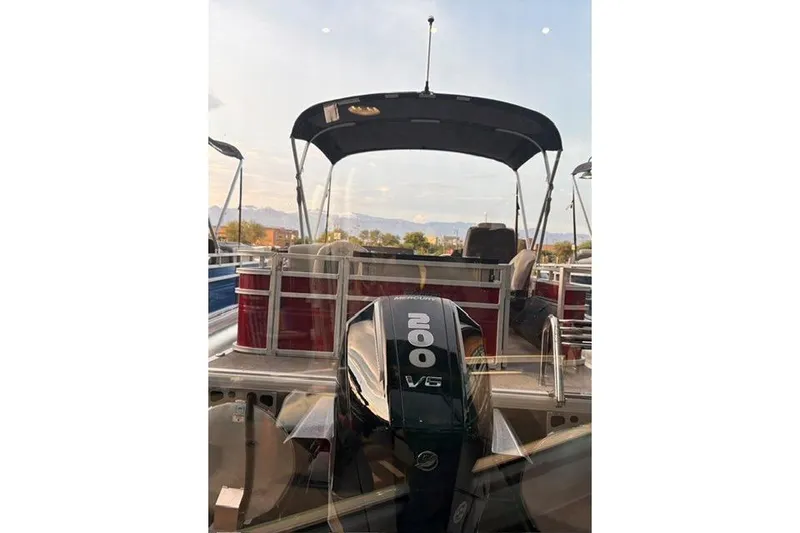Slide: The Image of 2026 Sun Tracker Fishin' Barge 22 XP3 with 200 V6 engine, rear view. - 2