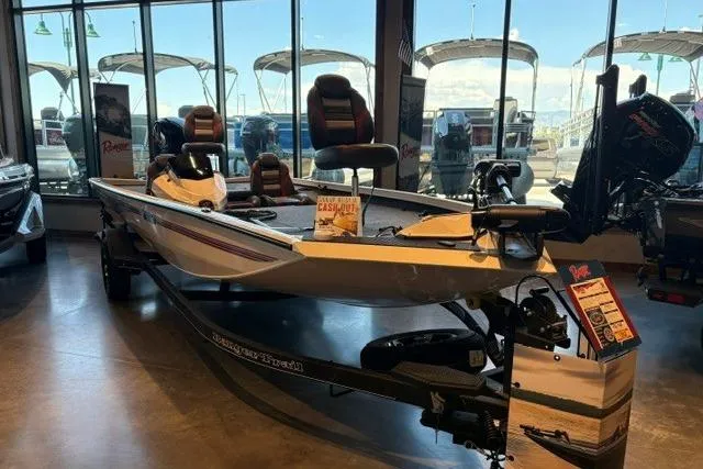 The Image of 2026 Ranger RT198P fishing boat displayed in showroom with seating and equipment. - 0