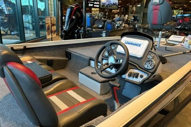Slide: The Image of 2026 Ranger RT198P boat interior with steering wheel and Lowrance electronics display. - 3