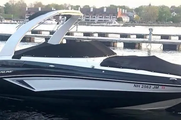 Slide: The Image of 2020 Crownline Eclipse E255 boat docked by the waterfront. - 3