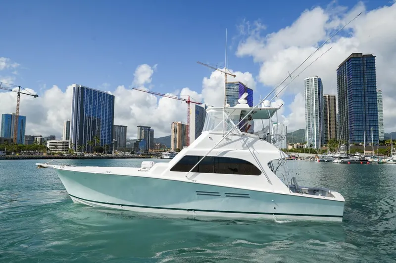 Slide: The Image of 1998 Post 50 yacht in urban harbor with skyscrapers and cranes in the background. - 1