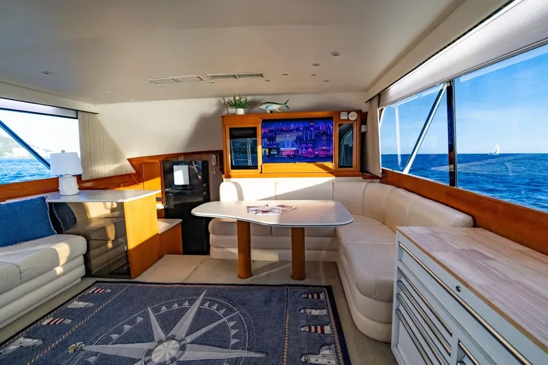 Slide: The Image of Luxurious 1998 Post 50 yacht interior with ocean view, featuring elegant seating and decor. - 10