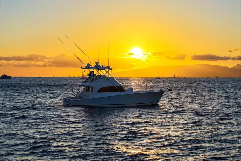 Slide: The Image of A 1998 Post 50 yacht sailing at sunset on a tranquil ocean. - 11