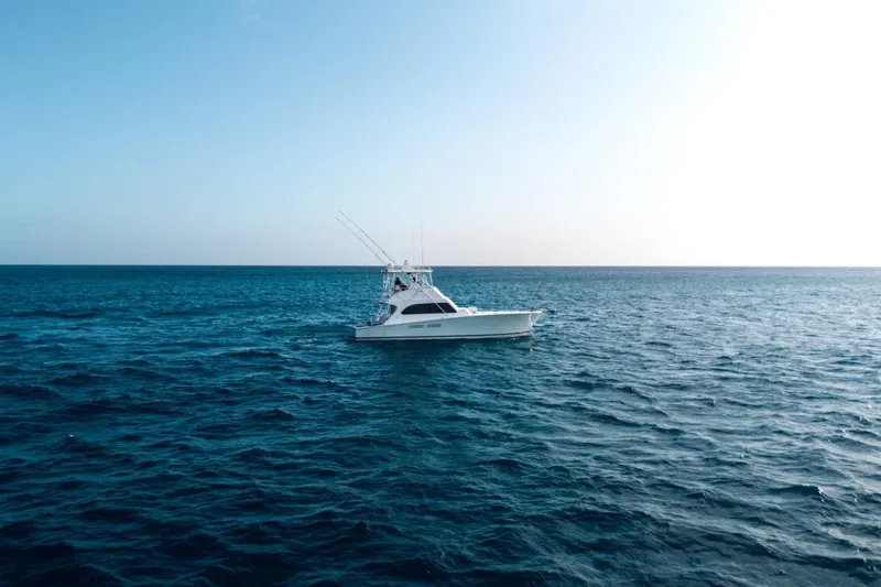 Slide: The Image of A 1998 Post 50 yacht cruising on the open ocean under a clear sky. - 25
