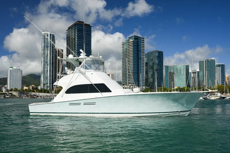 Slide: The Image of Luxury yacht "Post 50" from 1998 in urban marina setting with skyscrapers. - 31