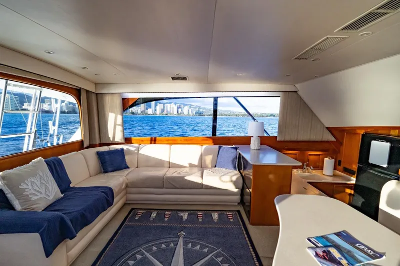Slide: The Image of Luxurious yacht interior with ocean view, featuring comfortable seating and elegant decor, Post 50, 1998. - 2