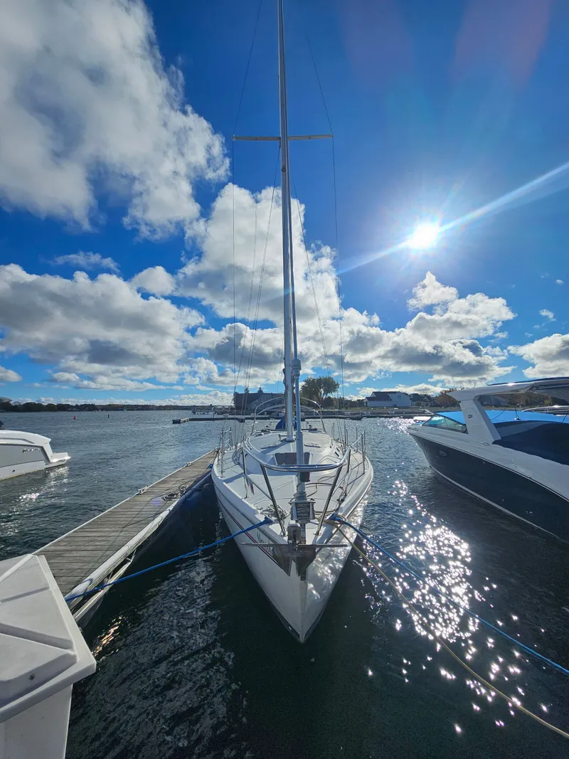 Slide: The Image of 1995 Catalina 36 MkII sailboat docked under sunny skies. - 3