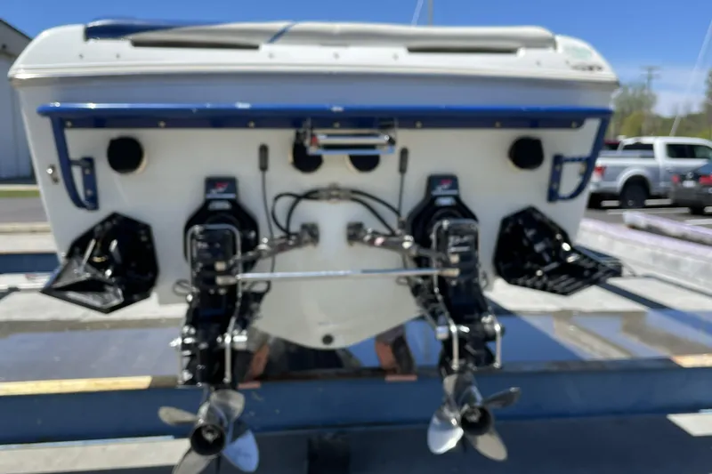 Slide: The Image of Rear view of a 2000 Baja 33 Outlaw boat with dual propellers. - 13