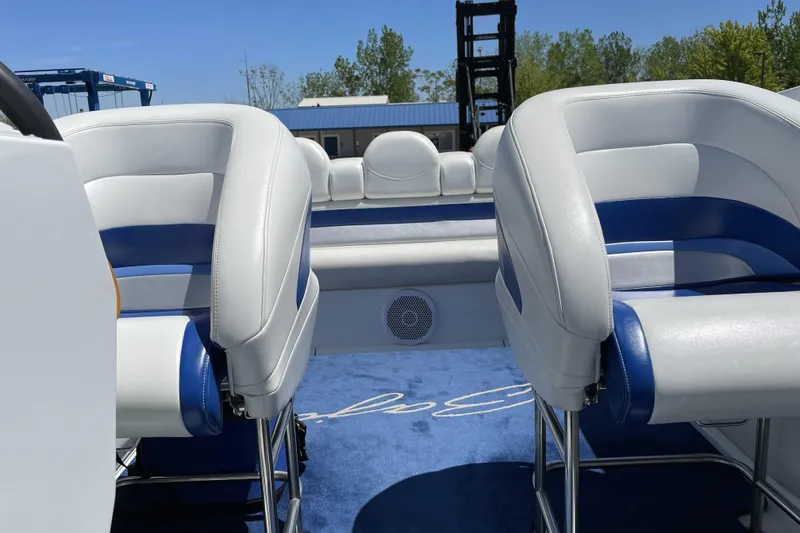 Slide: The Image of Interior of a 2000 Baja 33 Outlaw boat with white and blue seating. - 5