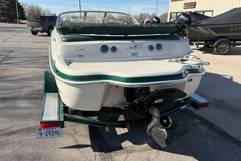 Slide: The Image of 2007 Tahoe Q4 boat on trailer, rear view, parked outdoors. - 5