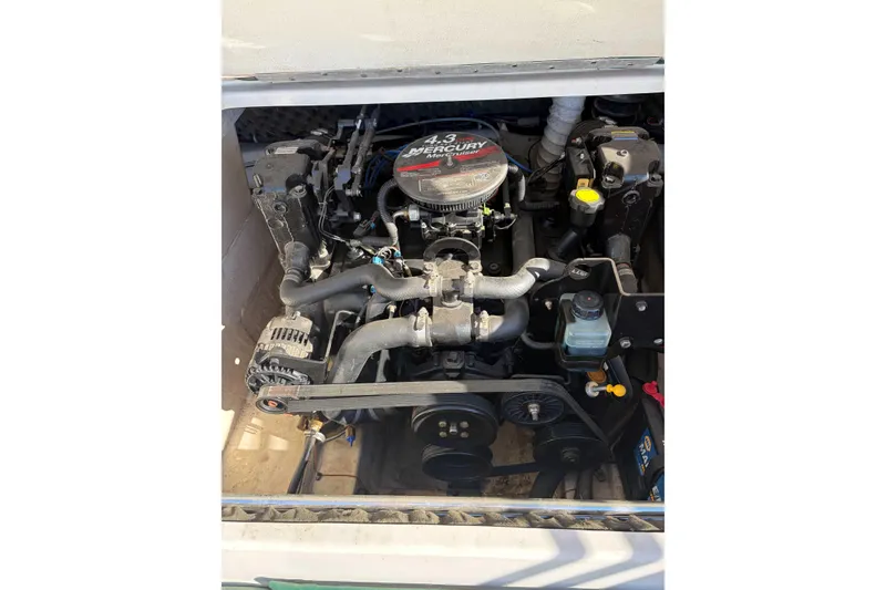 Slide: The Image of 2007 Tahoe Q4 boat engine compartment with Mercury 4.3 motor visible. - 6