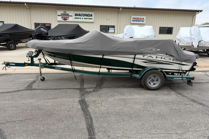 Slide: The Image of Covered 2007 Tahoe Q4 boat on trailer at dealership parking lot. - 7