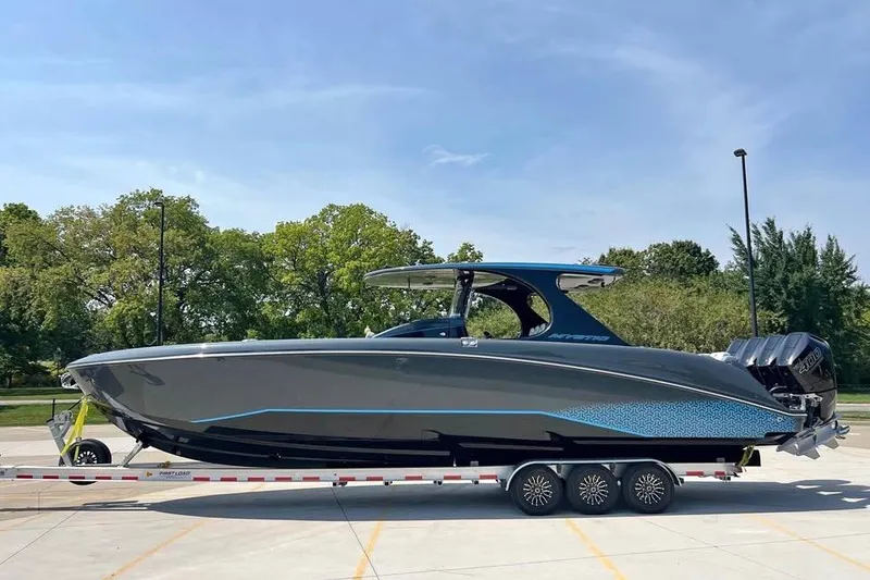 The Image of 2025 Mystic Powerboats M4200 on trailer, sleek design, parked outdoors. - 1