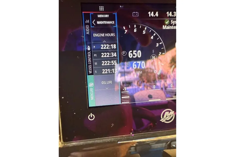 Slide: The Image of Dashboard of 2025 Mystic Powerboats M4200 showing engine hours and RPM. - 10