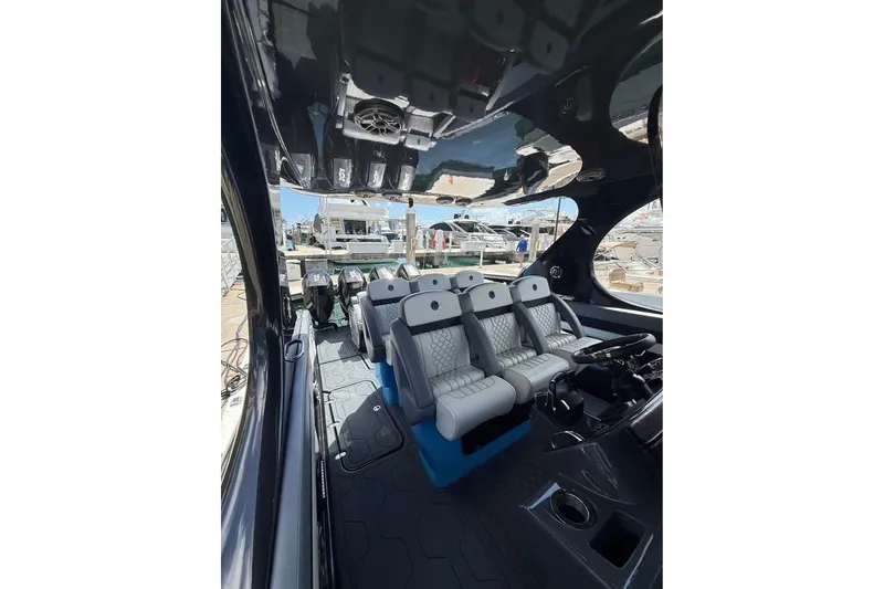Slide: The Image of Interior view of 2025 Mystic Powerboats M4200, showcasing luxurious seating and sleek design. - 5