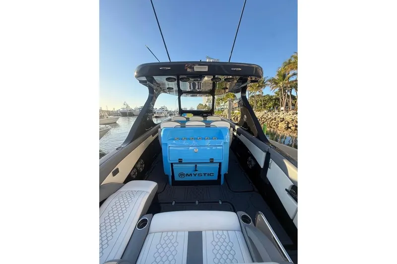 Slide: The Image of 2025 Mystic Powerboats M4200 interior with luxurious seating and sleek design. - 6