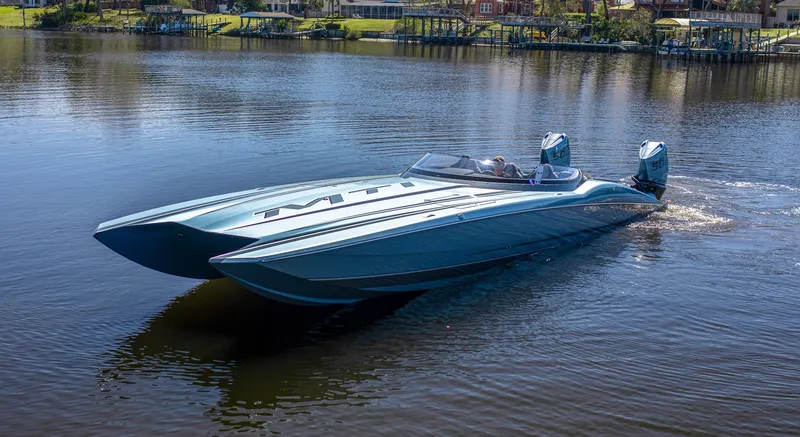 The Image of 2024 MTI 390X powerboat cruising on a calm lake. - 1