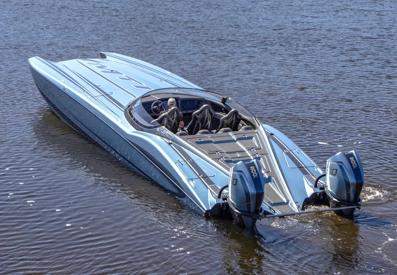 Slide: The Image of 2024 MTI 390X powerboat with dual engines cruising on water. - 10