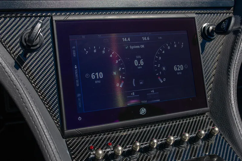 Slide: The Image of 2024 MTI 390X dashboard with digital display and carbon fiber finish. - 16
