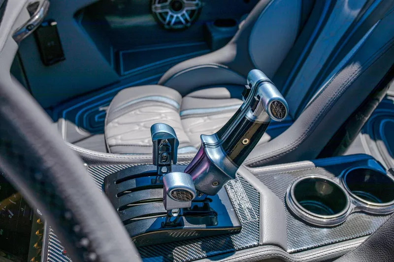 Slide: The Image of 2024 MTI 390X interior with sleek throttle controls and luxurious seating. - 17