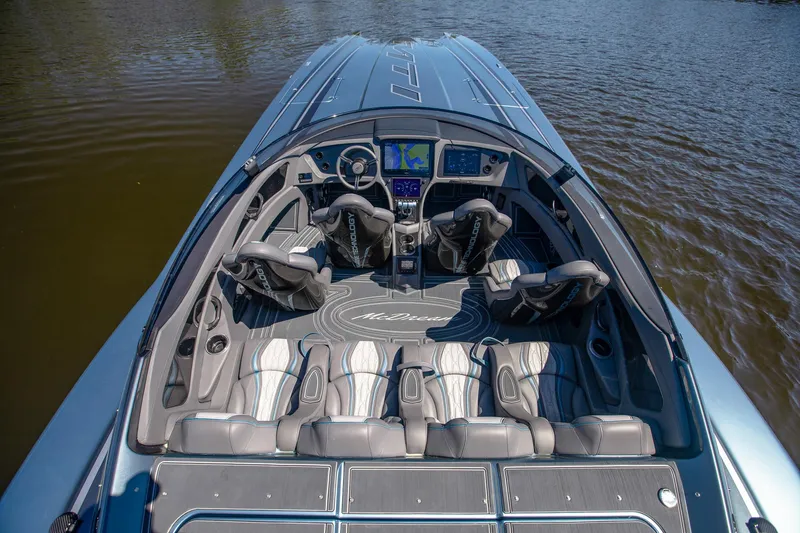 Slide: The Image of 2024 MTI 390X boat interior with advanced navigation system and luxurious seating on water. - 22