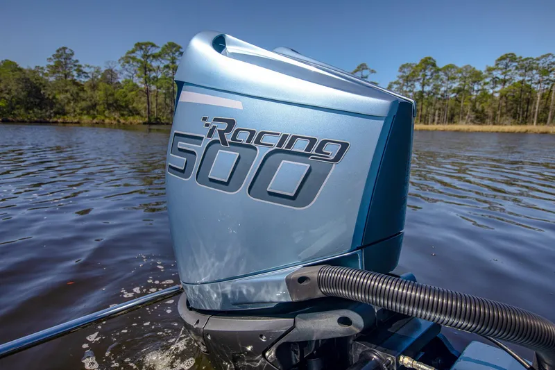 Slide: The Image of 2024 MTI 390X Racing 500 outboard motor on a lake. - 24