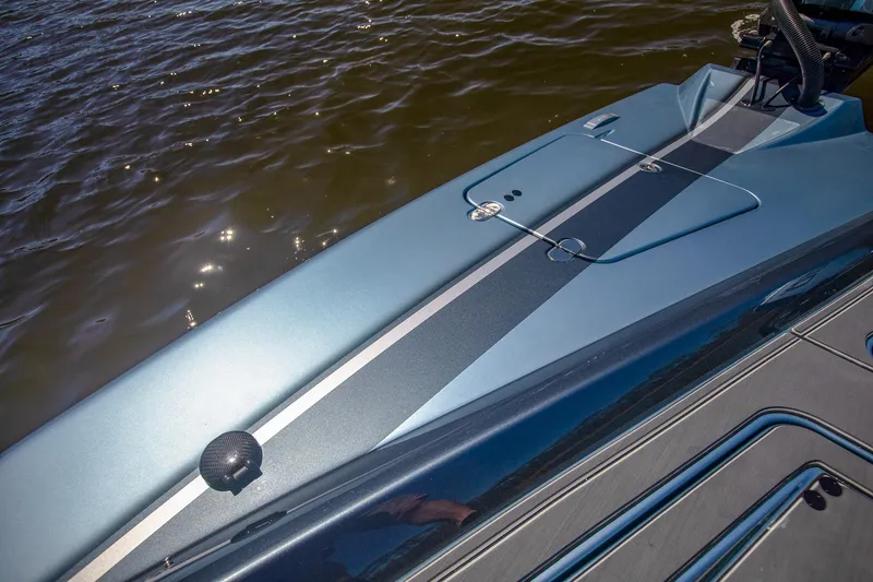 Slide: The Image of 2024 MTI 390X boat deck with sleek design on water. - 25